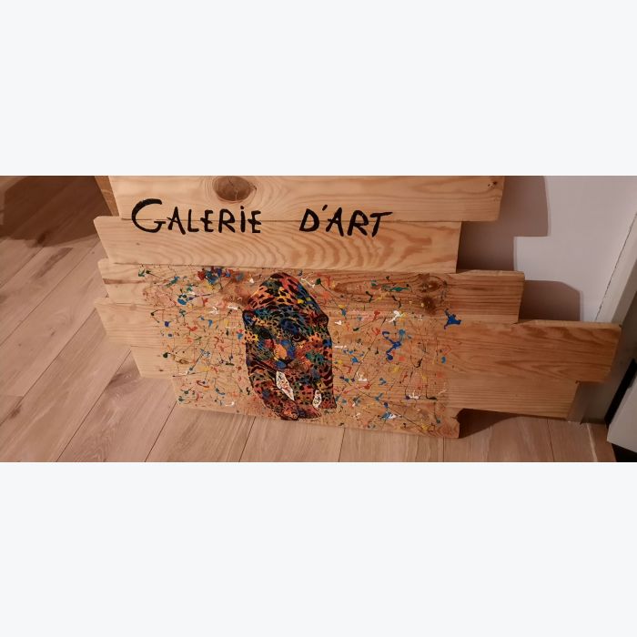 Tableau guépard sur planches de bois assemblées